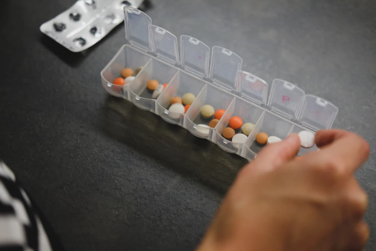 Tablets sorted into a day-by-day pill organiser